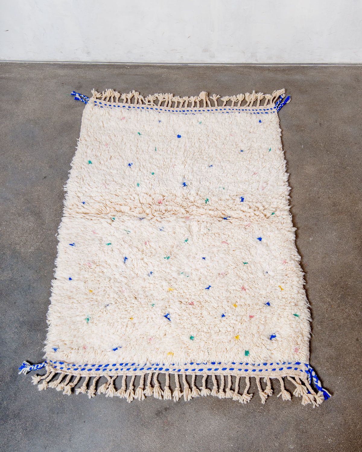 Modern, designer, handcrafted Berber rug from Morocco. Beniourain carpet with beautiful colours and patterns and fluffy wool texture.